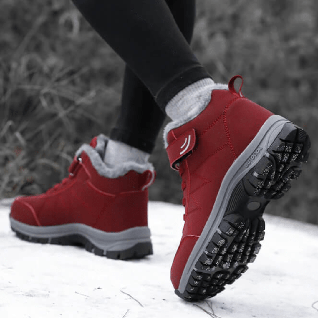 Black fleece lined orthopedic boots reaching just above the ankle