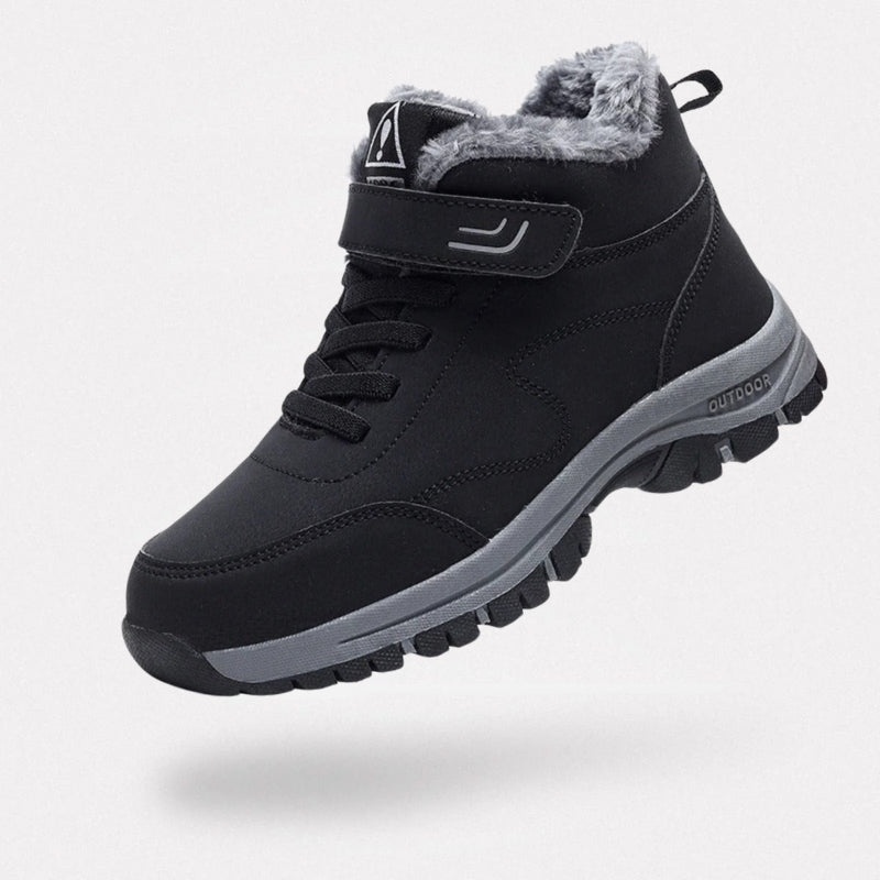 Black fleece lined orthopedic boots reaching just above the ankle