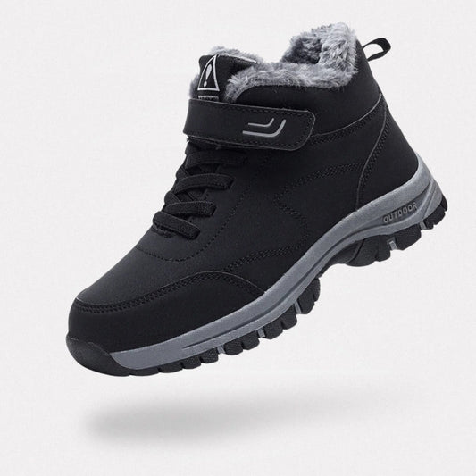Black fleece lined orthopedic boots reaching just above the ankle