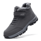 Black fleece lined orthopedic boots reaching just above the ankle
