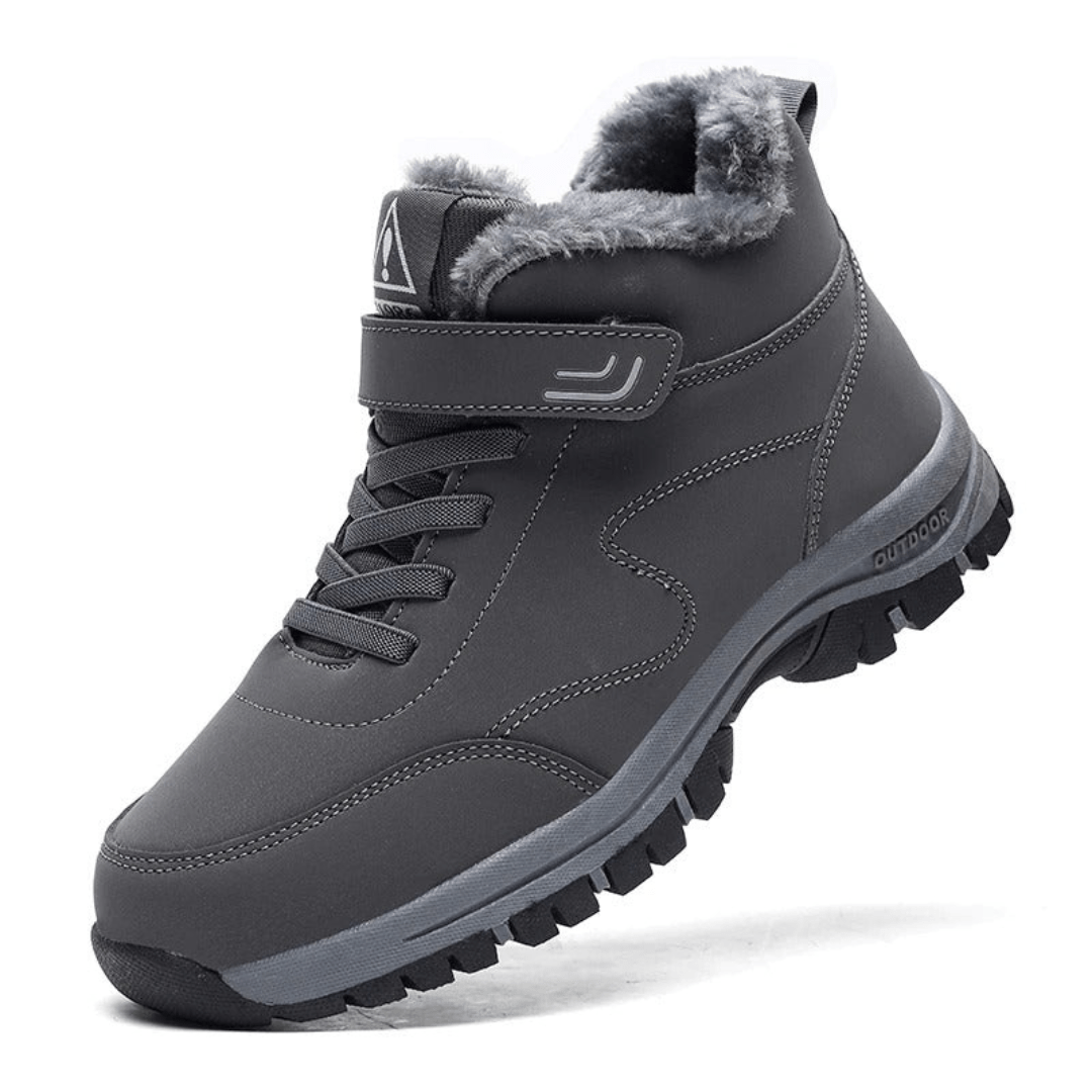 Black fleece lined orthopedic boots reaching just above the ankle