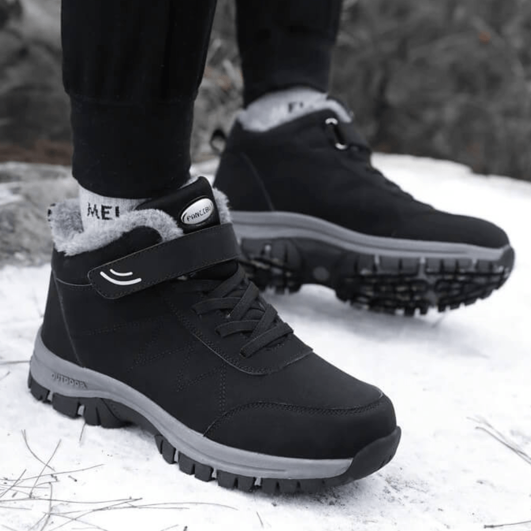 Black fleece lined orthopedic boots reaching just above the ankle