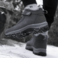 Black fleece lined orthopedic boots reaching just above the ankle