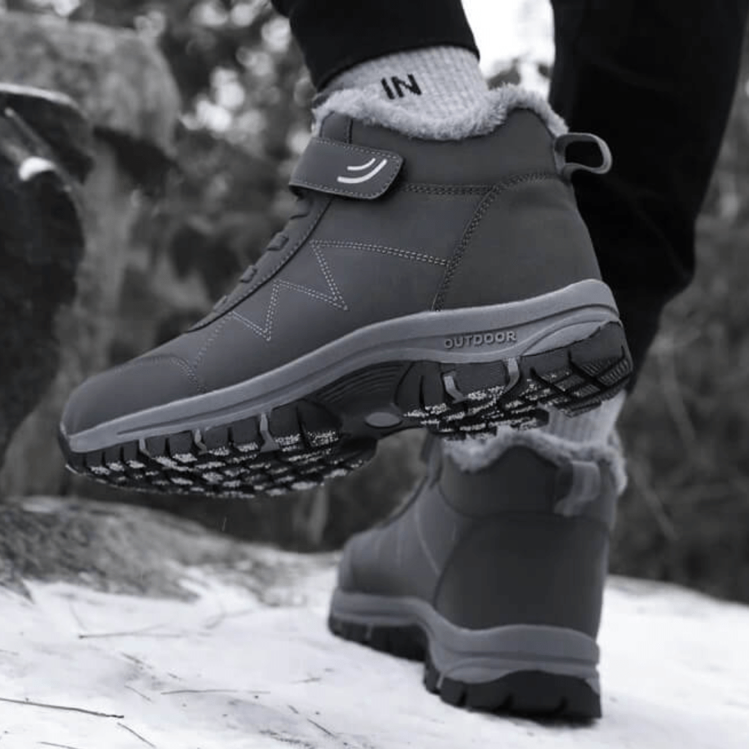 Black fleece lined orthopedic boots reaching just above the ankle