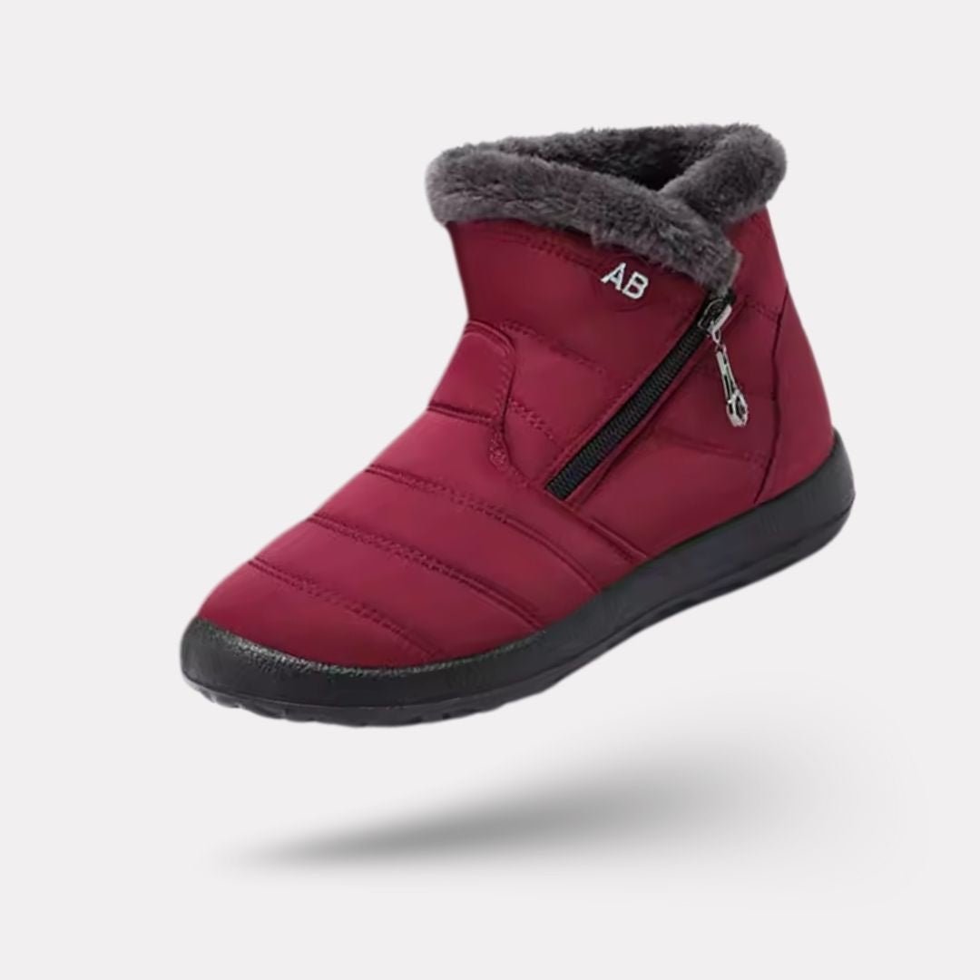 Navy waterproof snow boots for women, lined and reaching mid calf