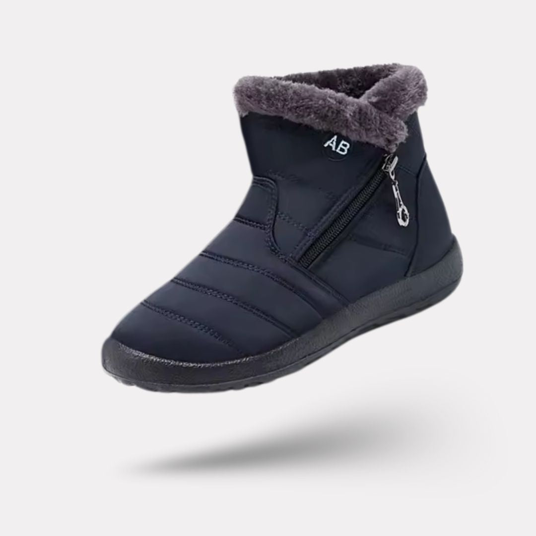 Navy waterproof snow boots for women, lined and reaching mid calf