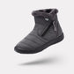 Navy waterproof snow boots for women, lined and reaching mid calf