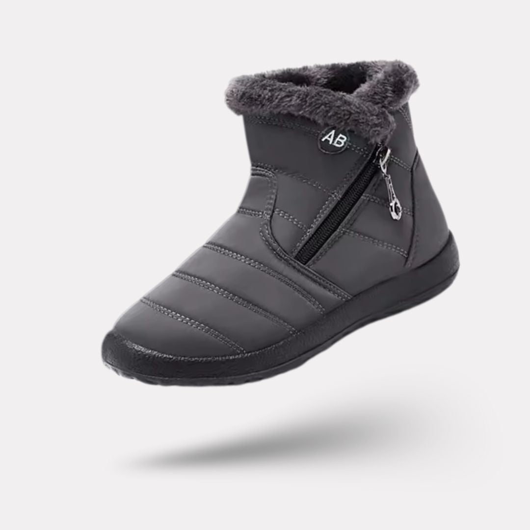 Navy waterproof snow boots for women, lined and reaching mid calf