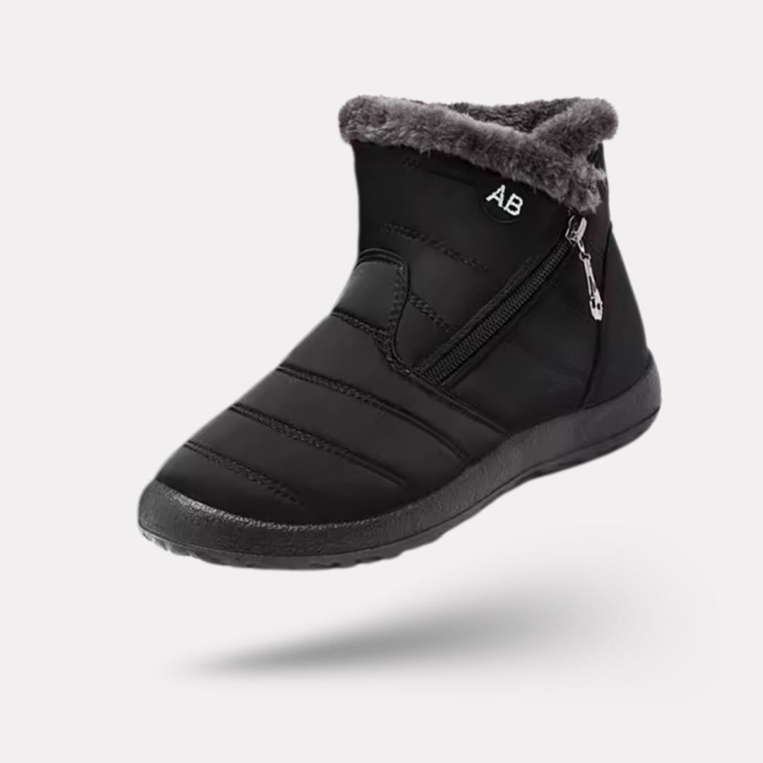 Navy waterproof snow boots for women, lined and reaching mid calf