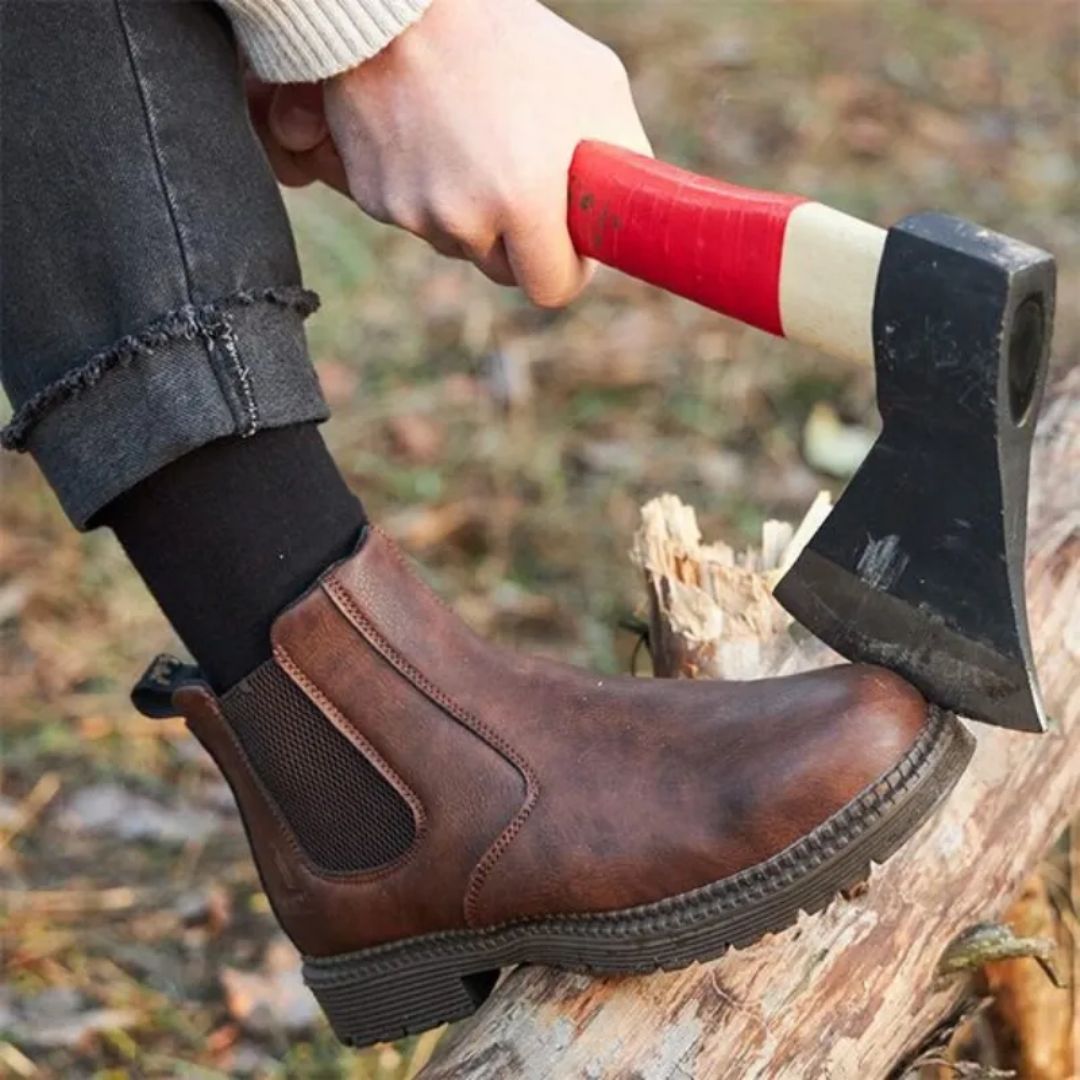 Brown leather safety boots with a reinforced toe and a lace-up ankle shaft