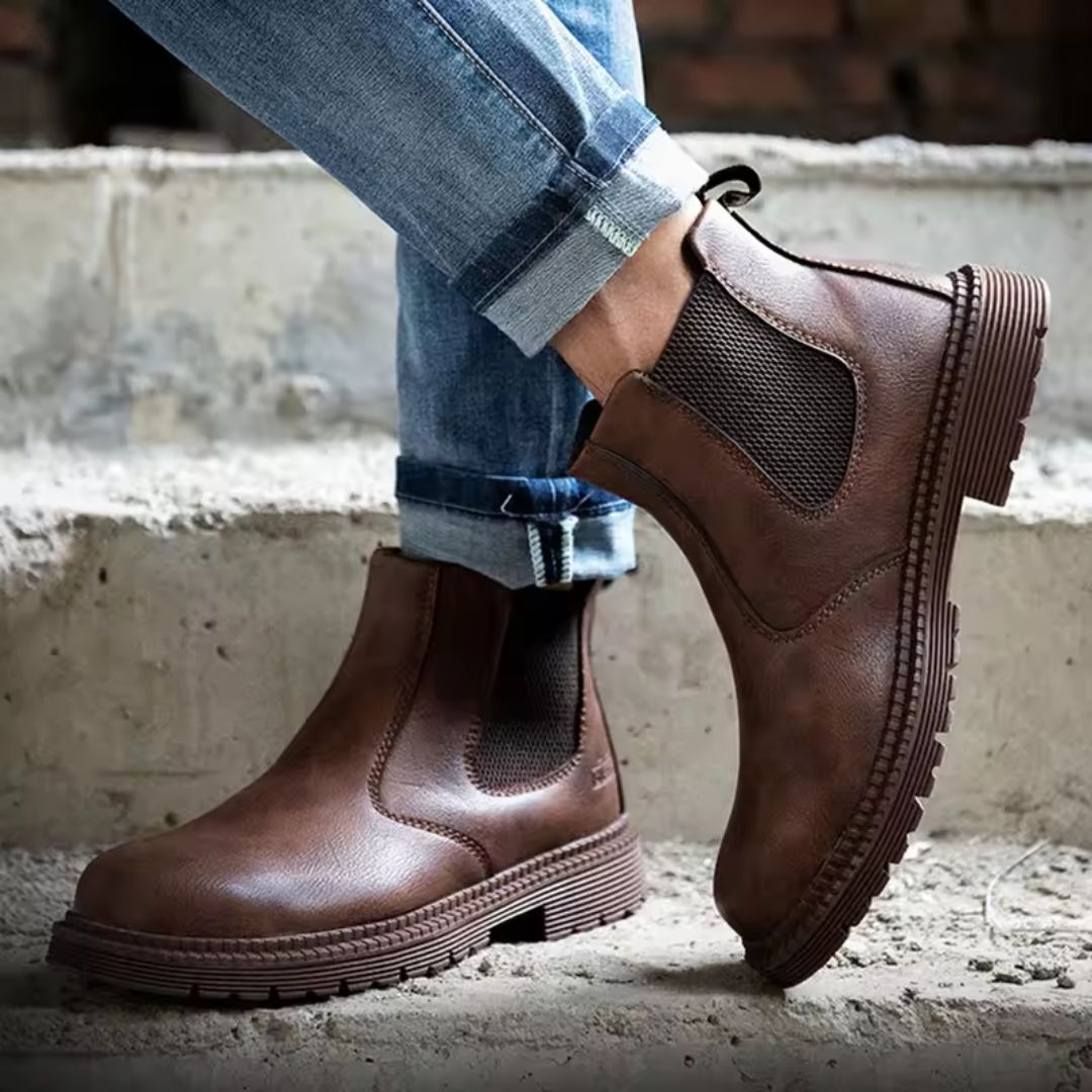 Brown leather safety boots with a reinforced toe and a lace-up ankle shaft