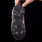 Black fleece lined orthopedic boots reaching just above the ankle