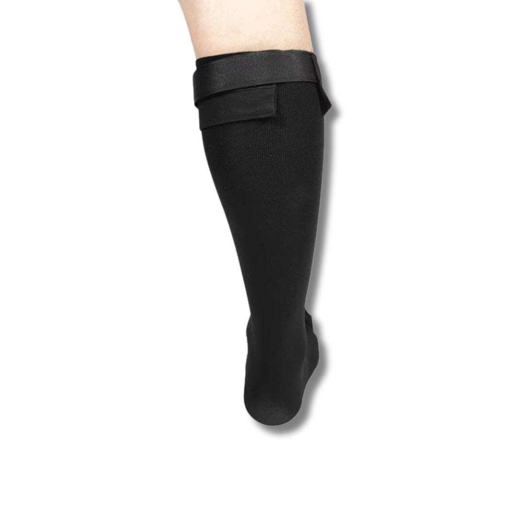 Black night socks worn over the foot and ankle to stretch the plantar arch