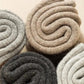 Merino wool socks in gray, black, khaki and beige, worn up to mid-calf