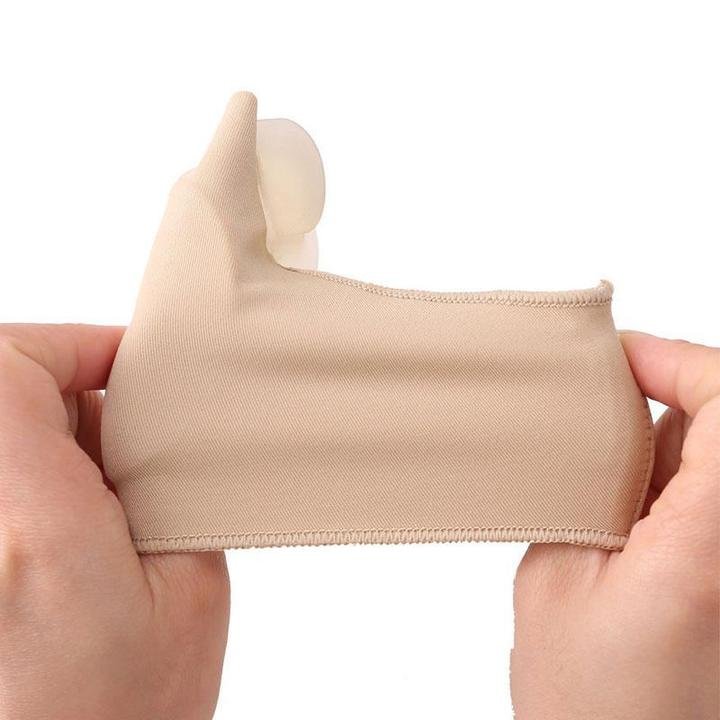 Bunion correction sock with separated toe loops, worn over the forefoot inside a shoe