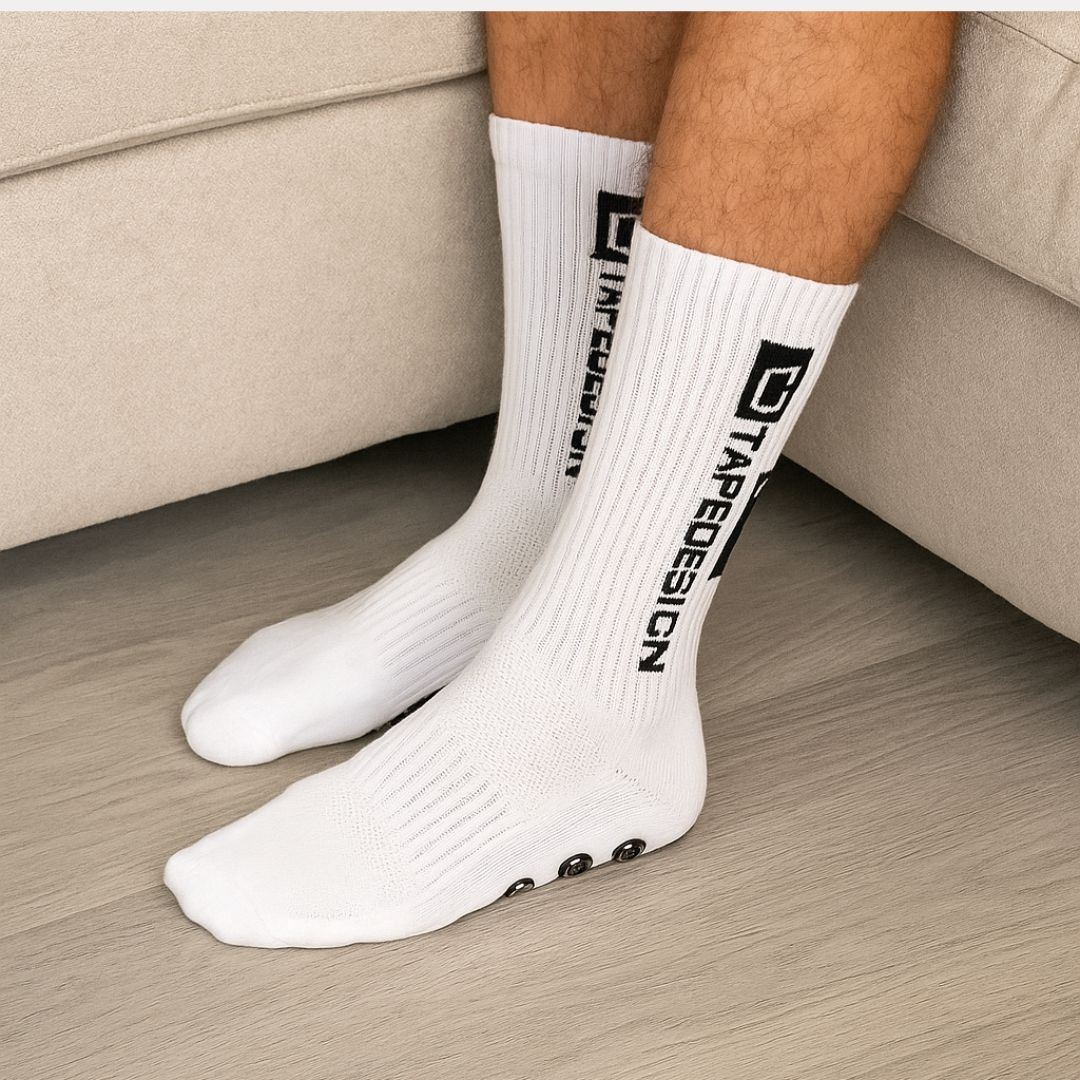 Set of white non-slip socks with rubber grip dots printed on the sole