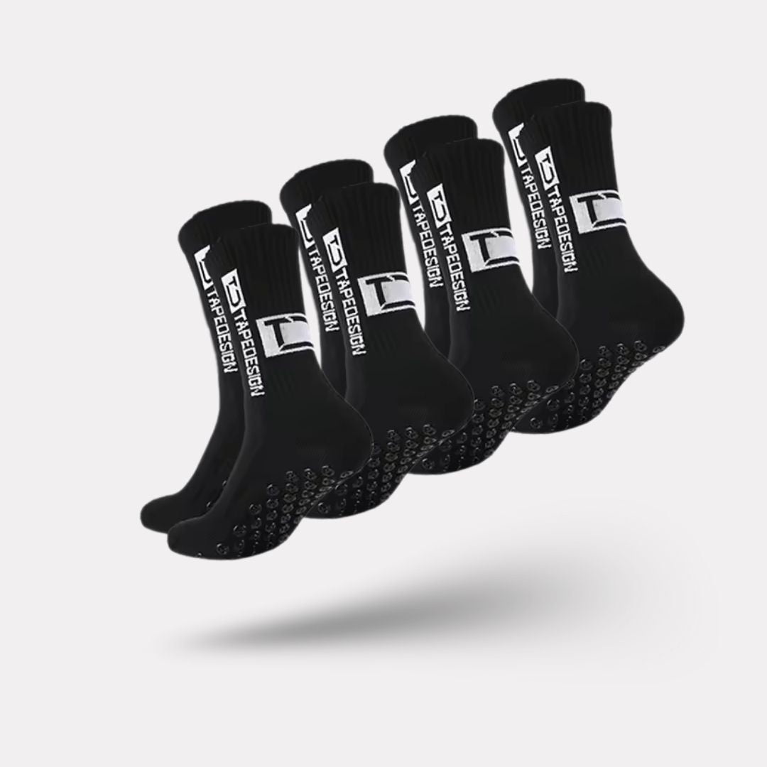 Set of white non-slip socks with rubber grip dots printed on the sole