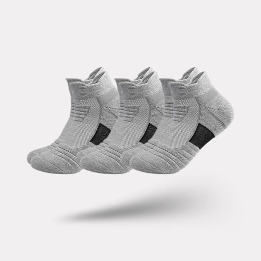 Three pairs of non-slip grip socks with rubber dots on the sole, in gray, black or white