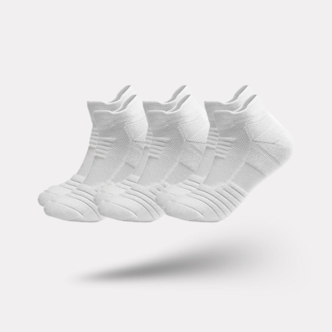 Three pairs of non-slip grip socks with rubber dots on the sole, in gray, black or white