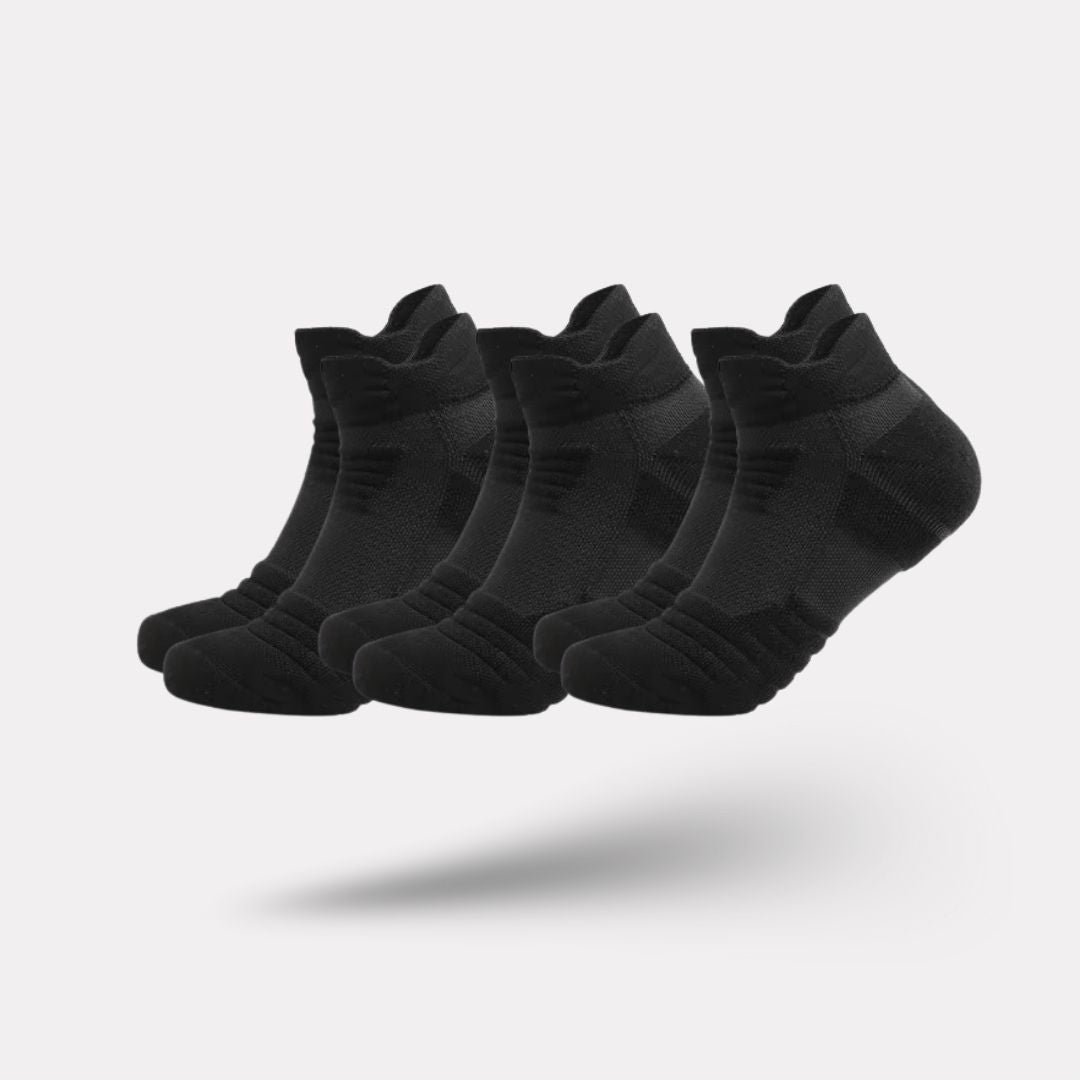 Three pairs of non-slip grip socks with rubber dots on the sole, in gray, black or white