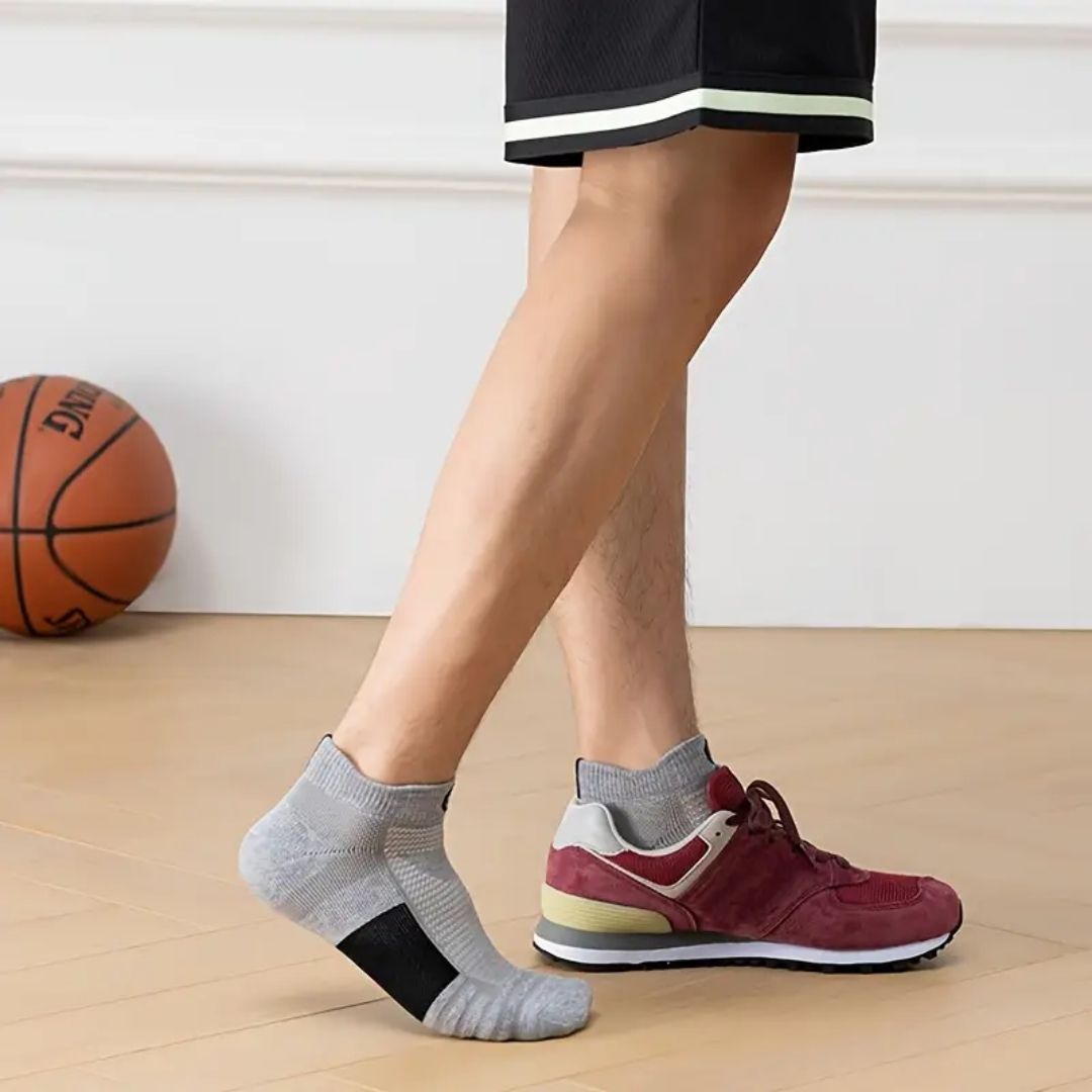 Three pairs of non-slip grip socks with rubber dots on the sole, in gray, black or white
