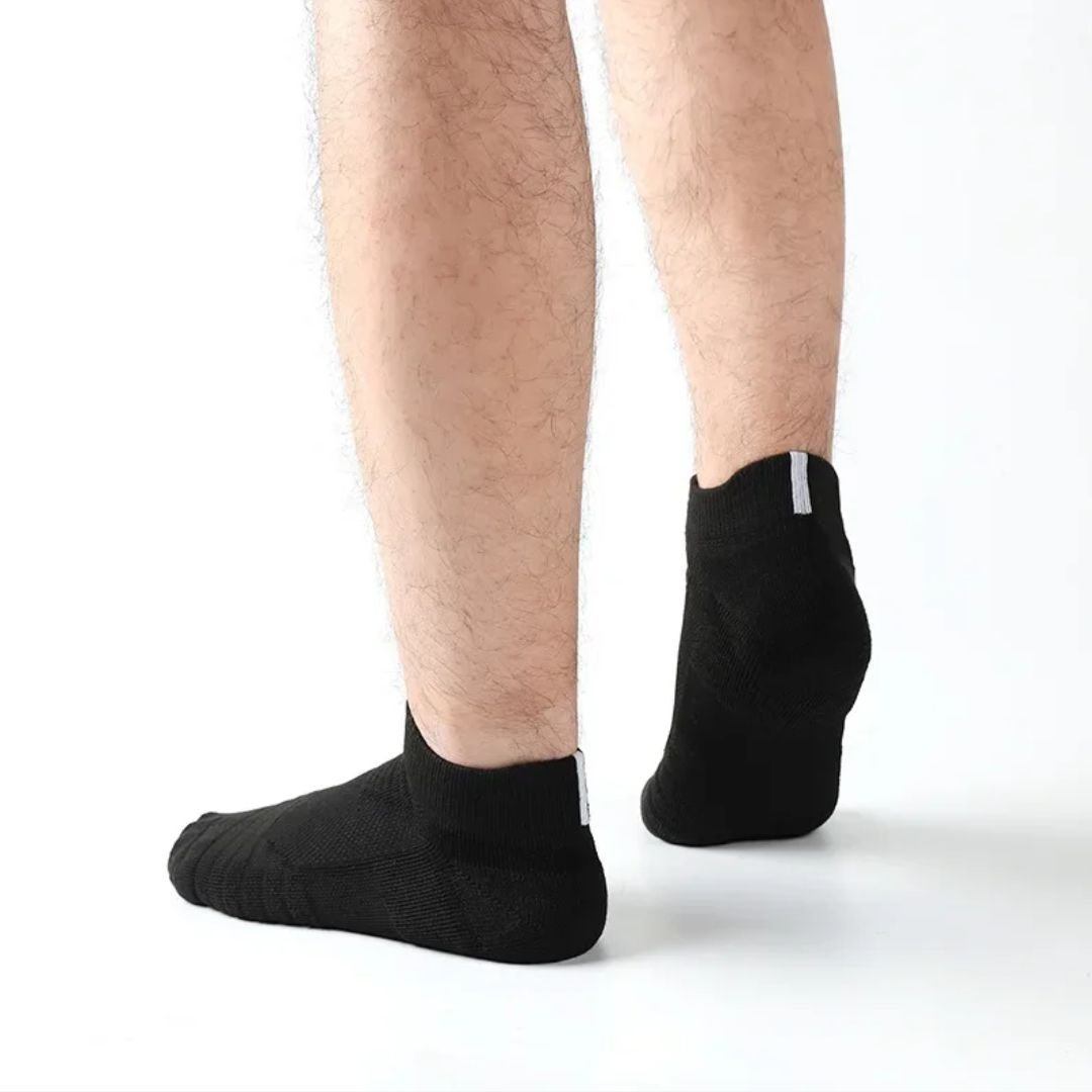 Three pairs of non-slip grip socks with rubber dots on the sole, in gray, black or white