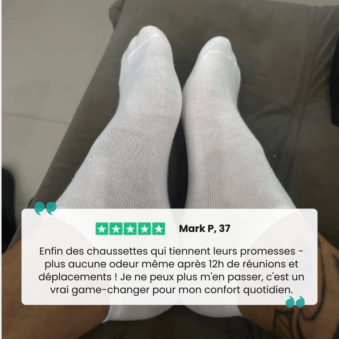Low-cut odor-control socks in black and white, cut to sit just below the ankle bone