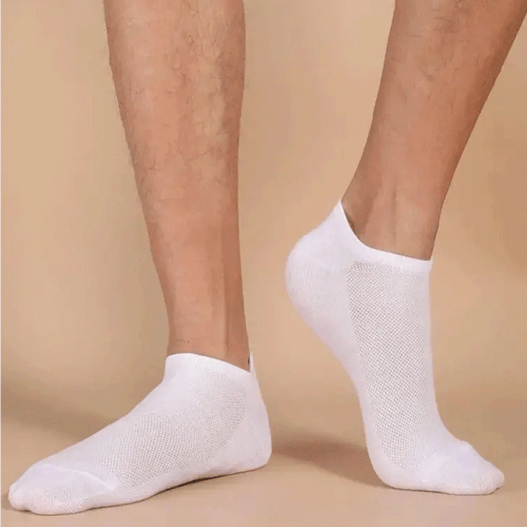 Low-cut odor-control socks in black and white, cut to sit just below the ankle bone