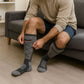 Battery-powered heated winter socks that warm the toes, worn up to mid-calf