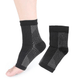 White and black anti-fatigue compression socks with flat seams, worn up the calf