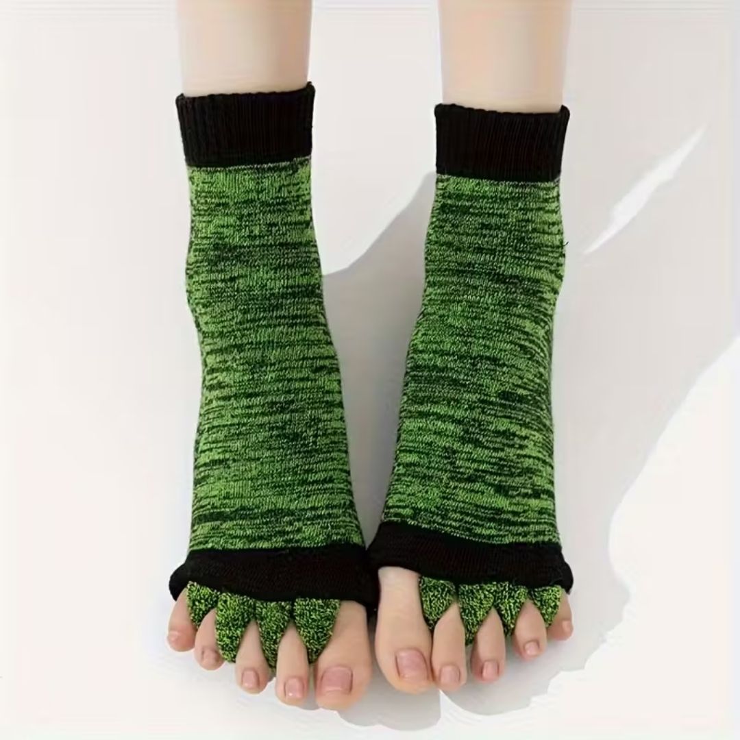 Bunion correction socks in black, gray, green and blue, worn over the forefoot and big toe