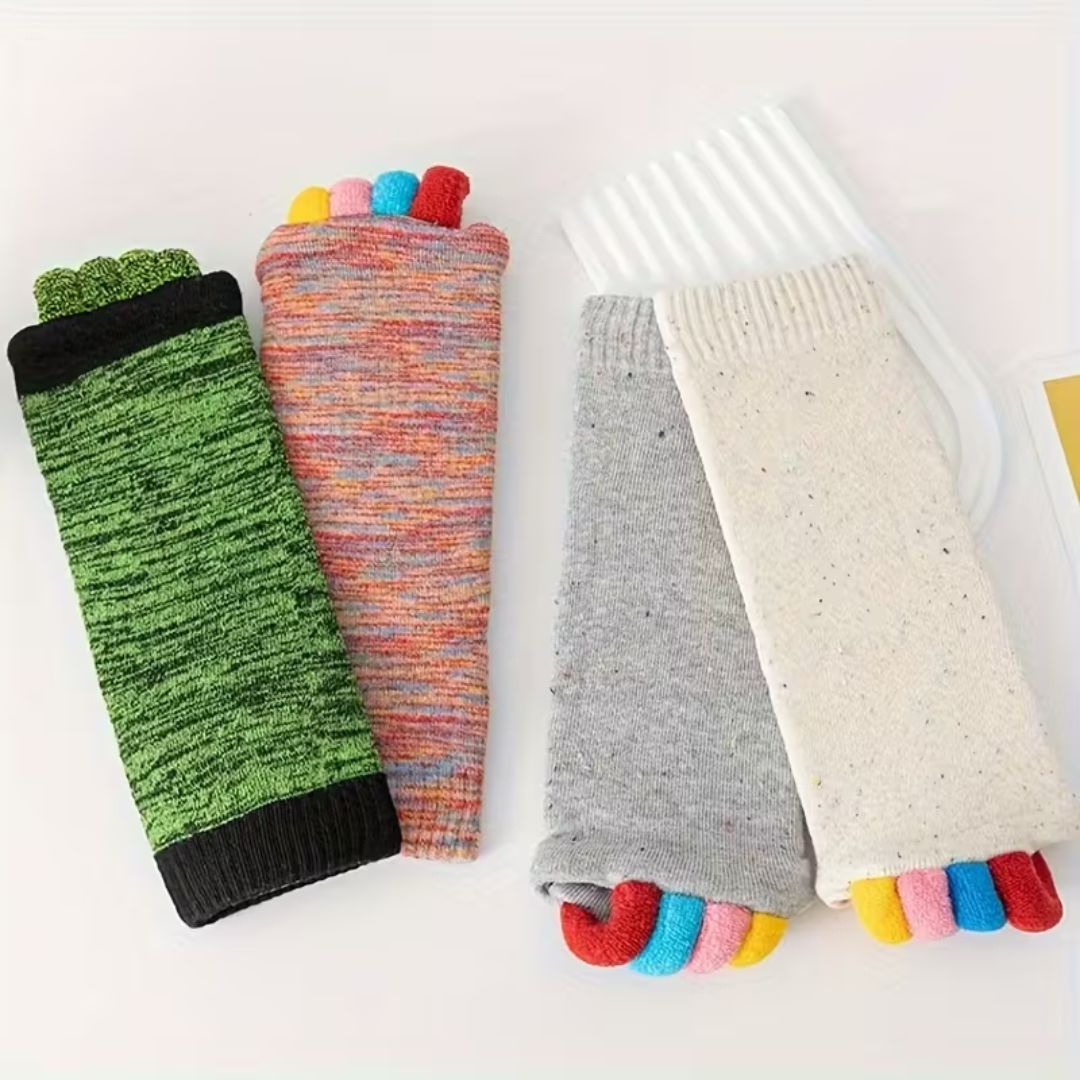 Bunion correction socks in black, gray, green and blue, worn over the forefoot and big toe