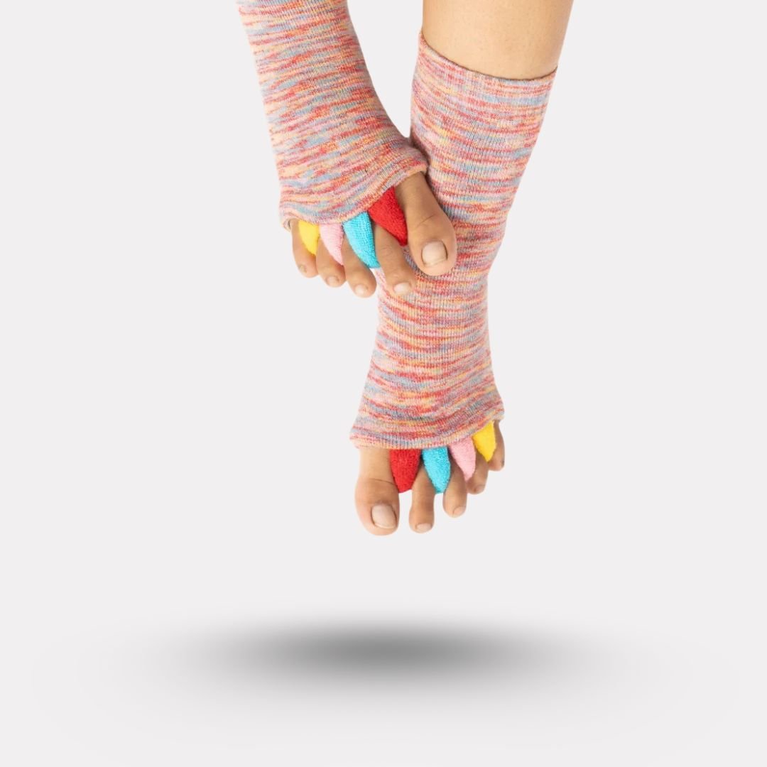 Bunion correction socks in black, gray, green and blue, worn over the forefoot and big toe