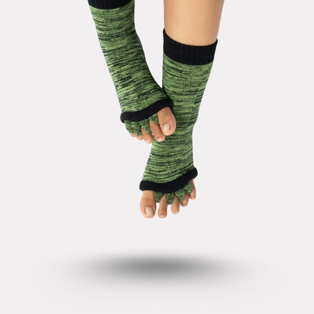 Bunion correction socks in black, gray, green and blue, worn over the forefoot and big toe