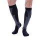 Black and white compression socks worn up the calf to support circulation