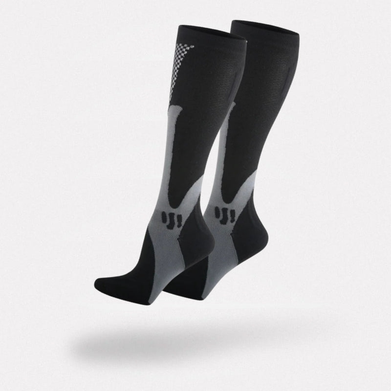 Black and white compression socks worn up the calf to support circulation