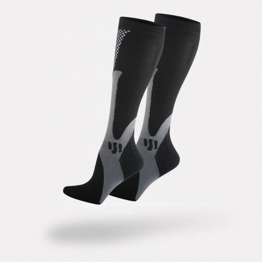Black and white compression socks worn up the calf to support circulation