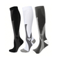 Black and white compression socks worn up the calf to support circulation