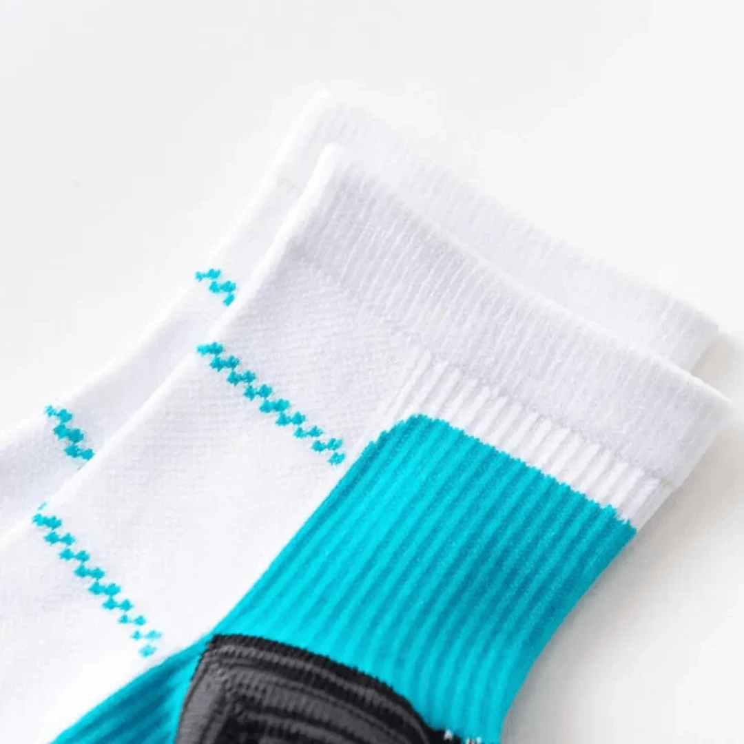 Knee-high compression socks with white panels along the calf, in blue, gray and black