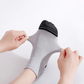 Gray compression socks with a firm band under the arch for plantar pain