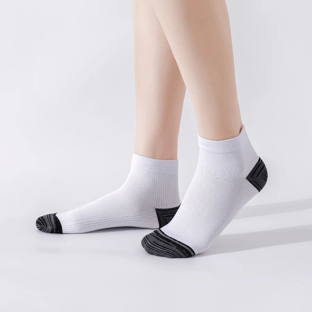 Gray compression socks with a firm band under the arch for plantar pain