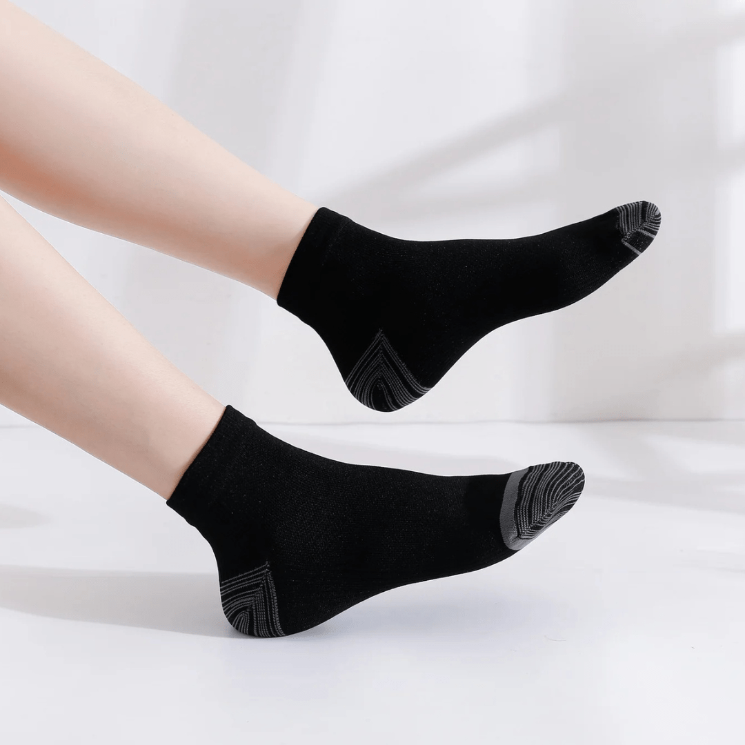 Gray compression socks with a firm band under the arch for plantar pain
