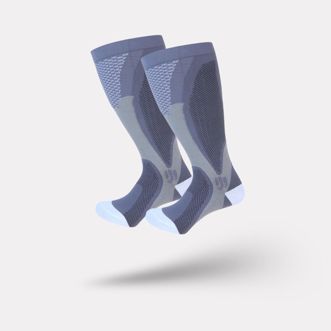 Plus size compression socks in 2XL to 4XL, worn up the calf, in black, white, gray or red