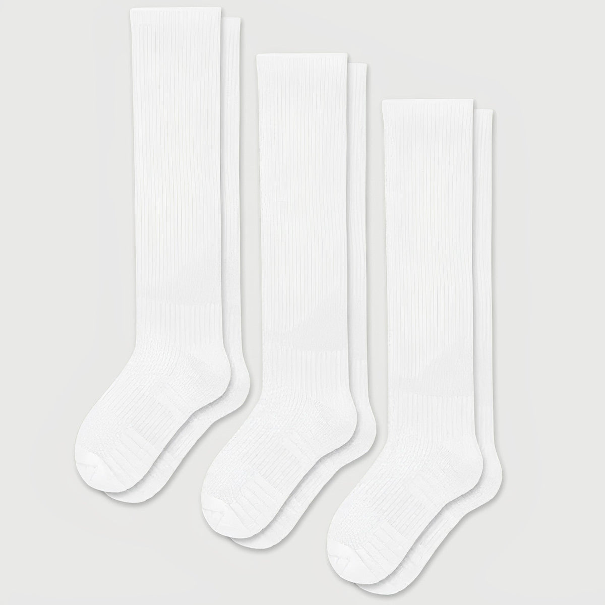 White seamless compression socks that stretch up the calf with no ridge at the toe