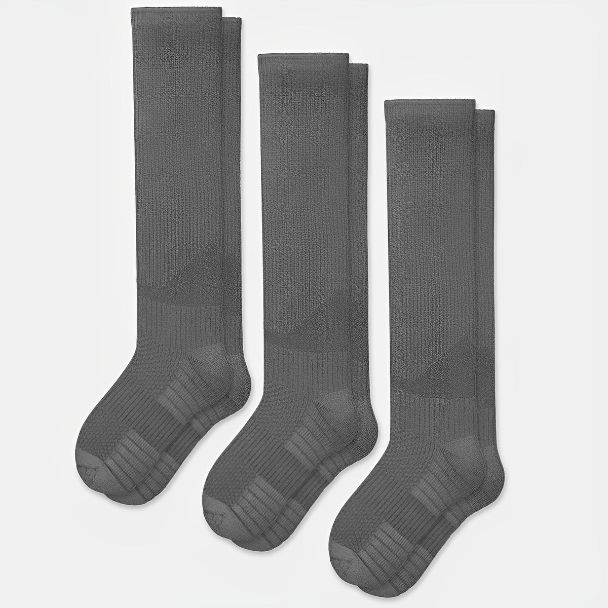 Gray seamless compression socks that stretch over the calf with no ridge at the toe