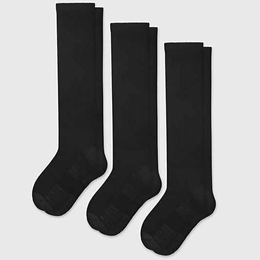 Black seamless compression socks that stretch over the calf with a wide non-binding top