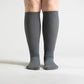 Gray seamless compression socks that stretch over the calf with no ridge at the toe
