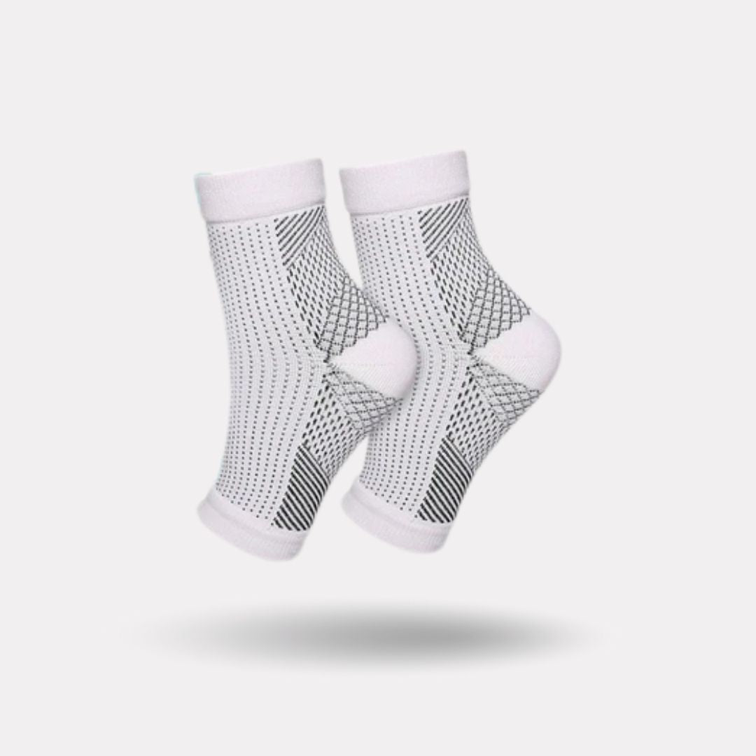 Knee-high therapeutic compression socks worn from the foot up to below the knee