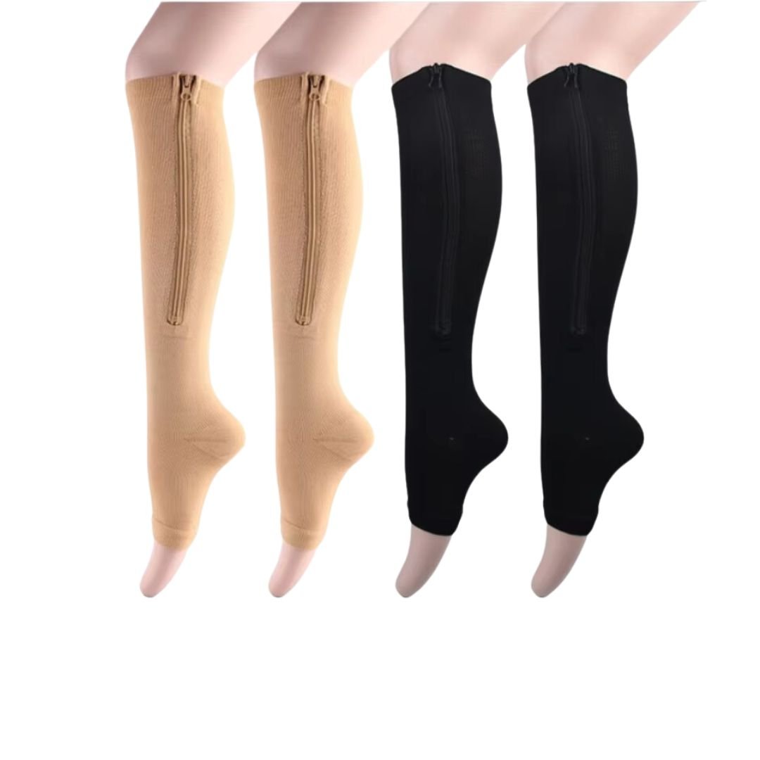 Women's compression socks in black and nude with a zipper running up the side of the calf