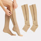 Women's compression socks in black and nude with a zipper running up the side of the calf